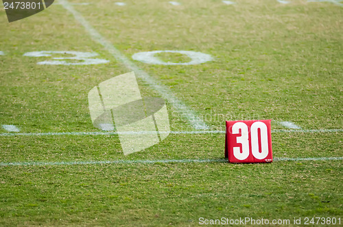 Image of football field 30 twenty yard line marker
