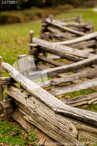 Image of Beautiful Autumn scene showing rustic old log cabin surrounded b