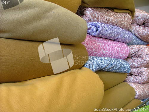 Image of folded piles of fabric