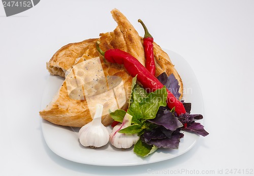 Image of vegetables on a plate with a slice of bread