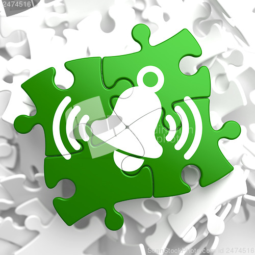 Image of Ringing White Bell Icon on Green Puzzle.