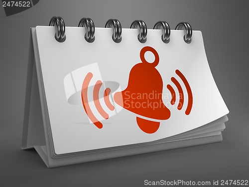 Image of Desktop Calendar with Red Ringing Bell Icon.