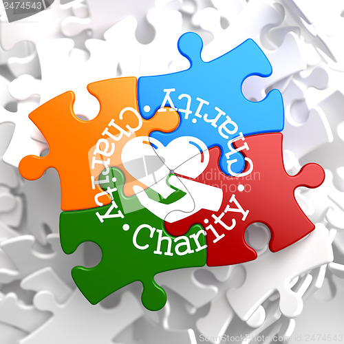 Image of Charity Concept on Multicolor Puzzle.