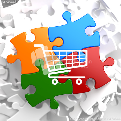 Image of Shopping Cart Icon on Multicolor Puzzle.