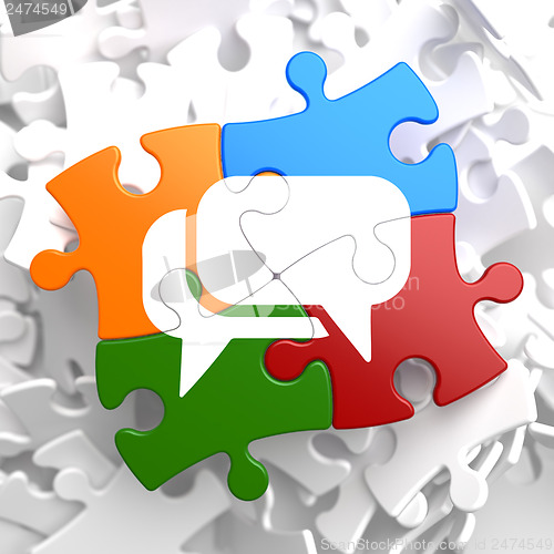 Image of White Speech Bubble Icon on Multicolor Puzzle.