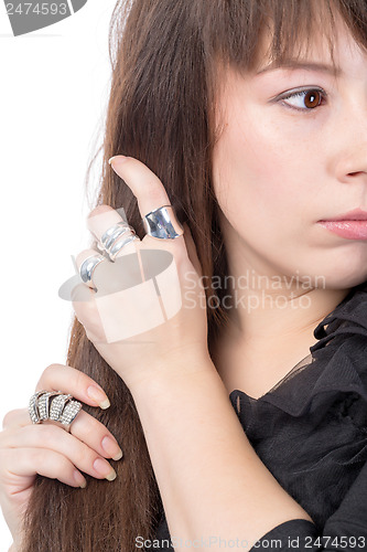 Image of Woman wearing multiple rings