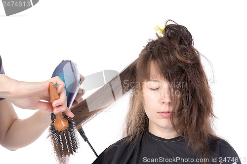 Image of Woman enjoying having her hair blow dried