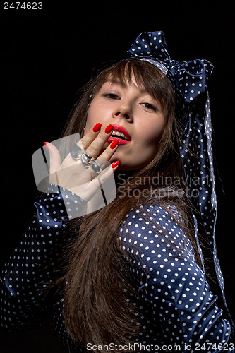 Image of Elegant sensual woman applying red lipstick