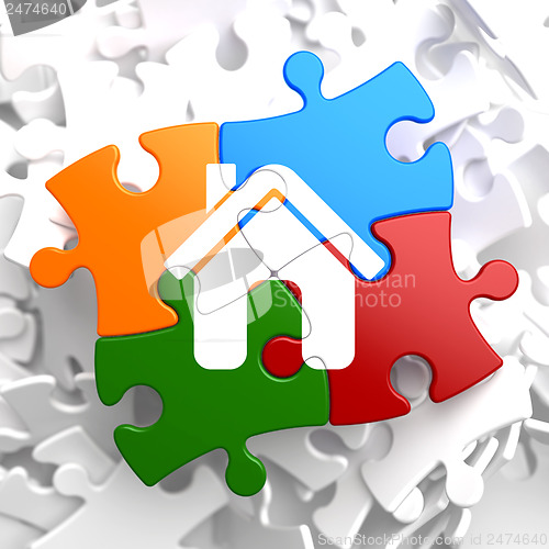 Image of Home Icon on Multicolor Puzzle.