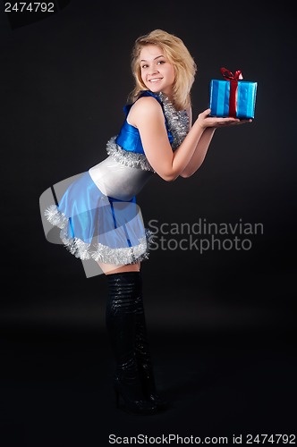 Image of Beautiful christmas woman with gift