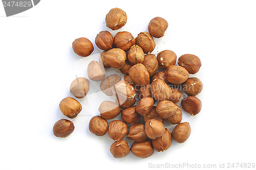 Image of handful of nuts of a filbert on a white background