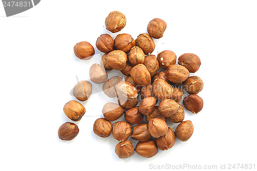 Image of handful of nuts of a filbert on a white background