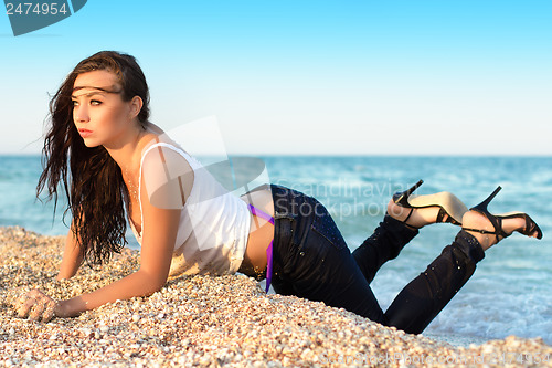 Image of Brunette in wet clothes