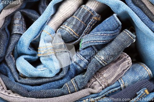 Image of stack of various jeans