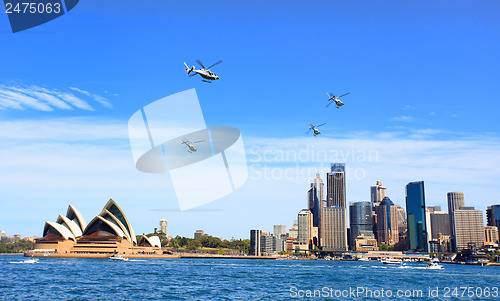 Image of Military helicopters fly over Sydney Australia