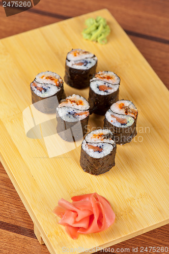 Image of sushi rolls with tobico and pancake