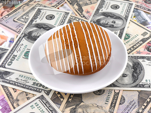 Image of cake on money dollars background