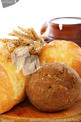 Image of Bread, milk and wheat ears.