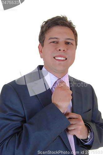 Image of Man fixing his tie.