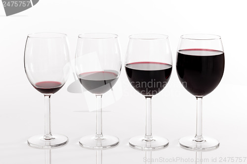 Image of Glasses with different quantities of red wine