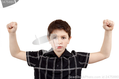Image of Portrait of a young boy with hand raised up