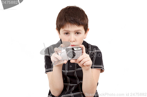 Image of small boy photographing horizontal with digital camera