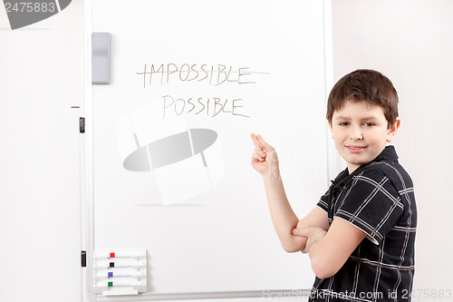 Image of happy little boy and white board