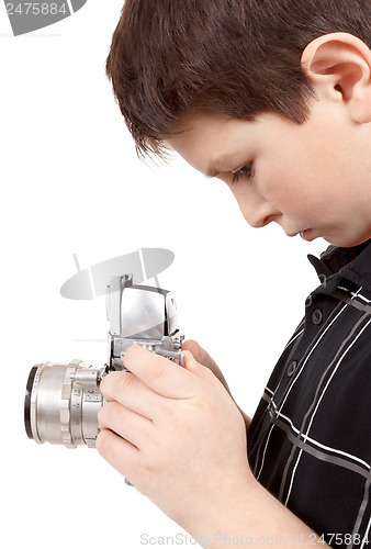 Image of young boy with old vintage analog SLR camera