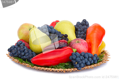 Image of Fruits , pepper and parsley leaves on a plate on a white backgro