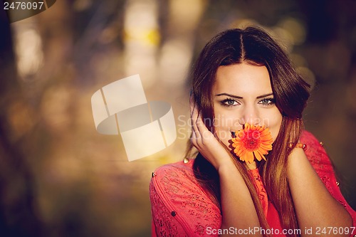 Image of Girl with a flower in his mouth