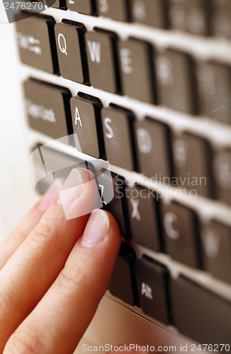 Image of Young woman working on laptop