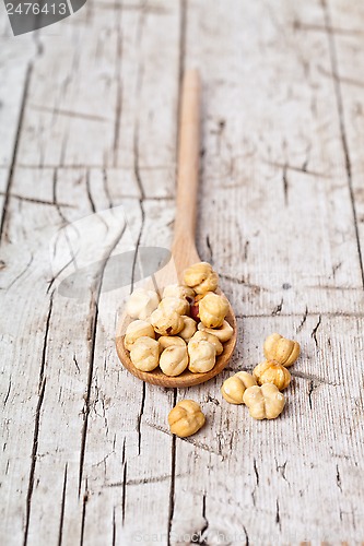 Image of hazelnuts in wooden spoon 