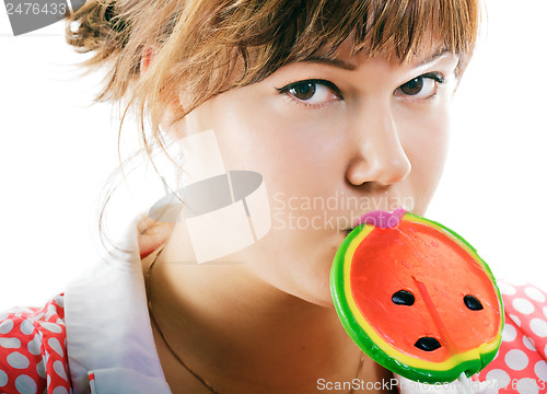 Image of attractive girl with a round lollipop