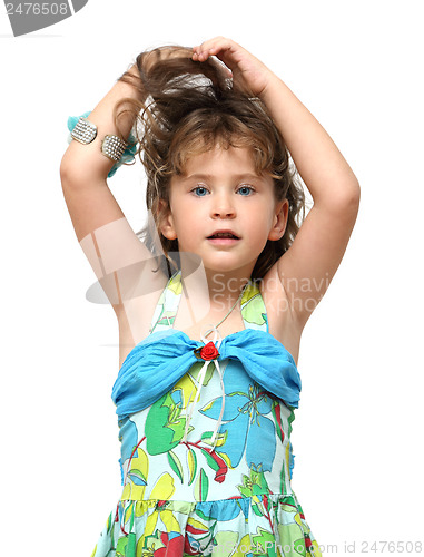 Image of adorable little girl raises her hair