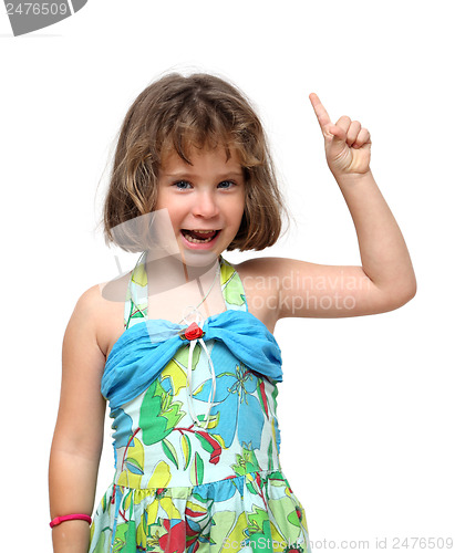 Image of cute little girl pointing with finger up