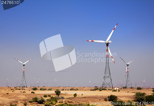 Image of wind farm - turning windmills in India