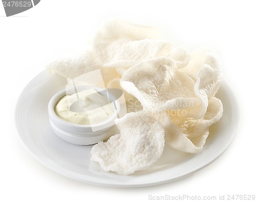 Image of prawn crackers on white plate