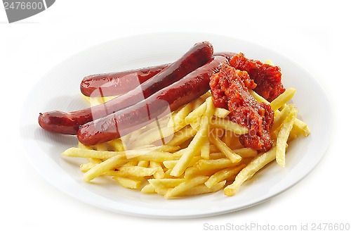 Image of french fries and grilled sausages