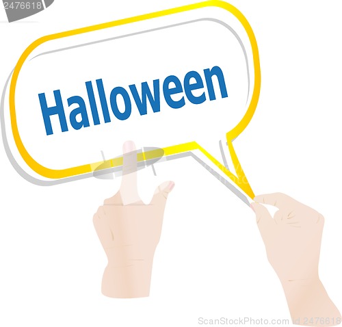 Image of hands push word halloween on speech bubbles, holiday card