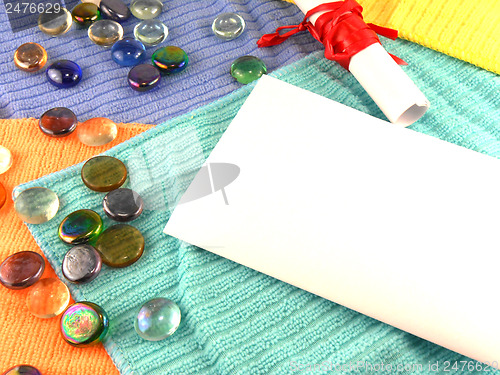 Image of white paper and stones, invitation card