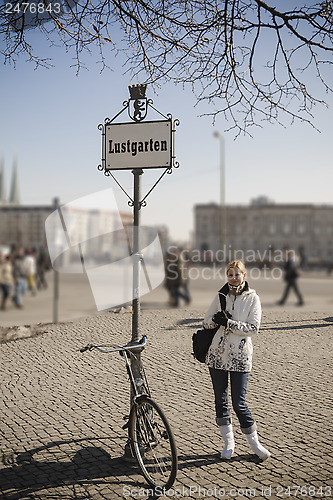 Image of Woman with antique bike on Lustgarten