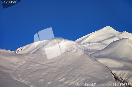 Image of Off-piste slope and blue clear sky in nice winter morning