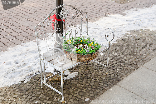 Image of Basket with flowers on the bench