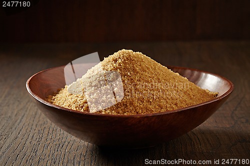 Image of brown sugar in a wooden bowl