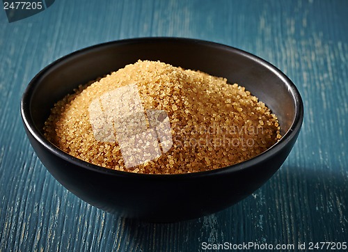 Image of Cane sugar in a black bowl