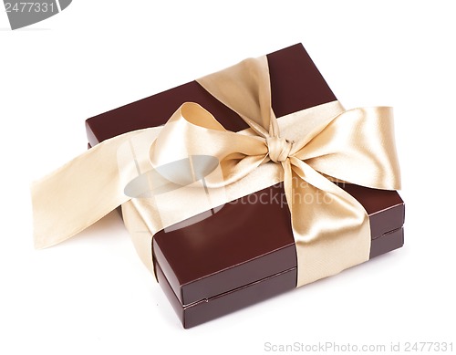 Image of Box with candies and golden tape