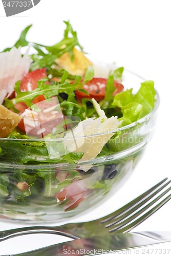 Image of fresh tomatoes, arugula, parmesan, raisin and croutons