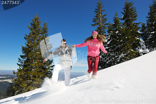 Image of Young Couple In Winter  Snow Scene