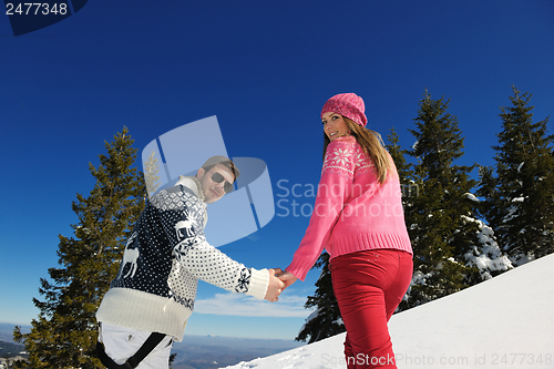 Image of Young Couple In Winter  Snow Scene