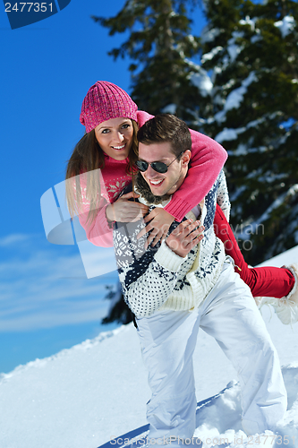 Image of Young Couple In Winter  Snow Scene